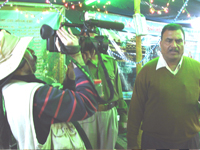Reporter covering inside display of the exhibition