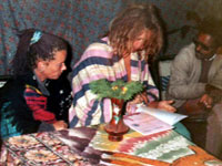 Foreign tourist fill visitor diary in the exhibition campus